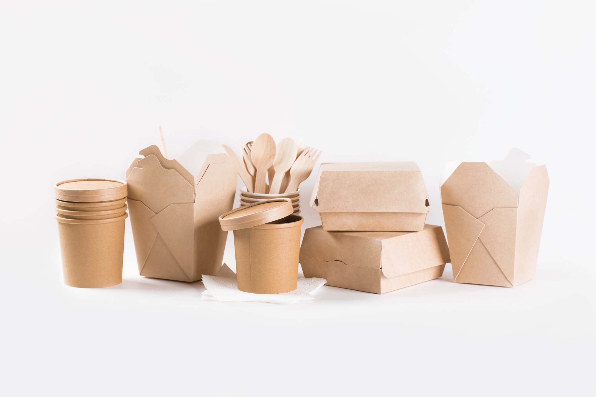Eco craft paper tableware. Paper cups, dishes, fast food containers and wooden cutlery.