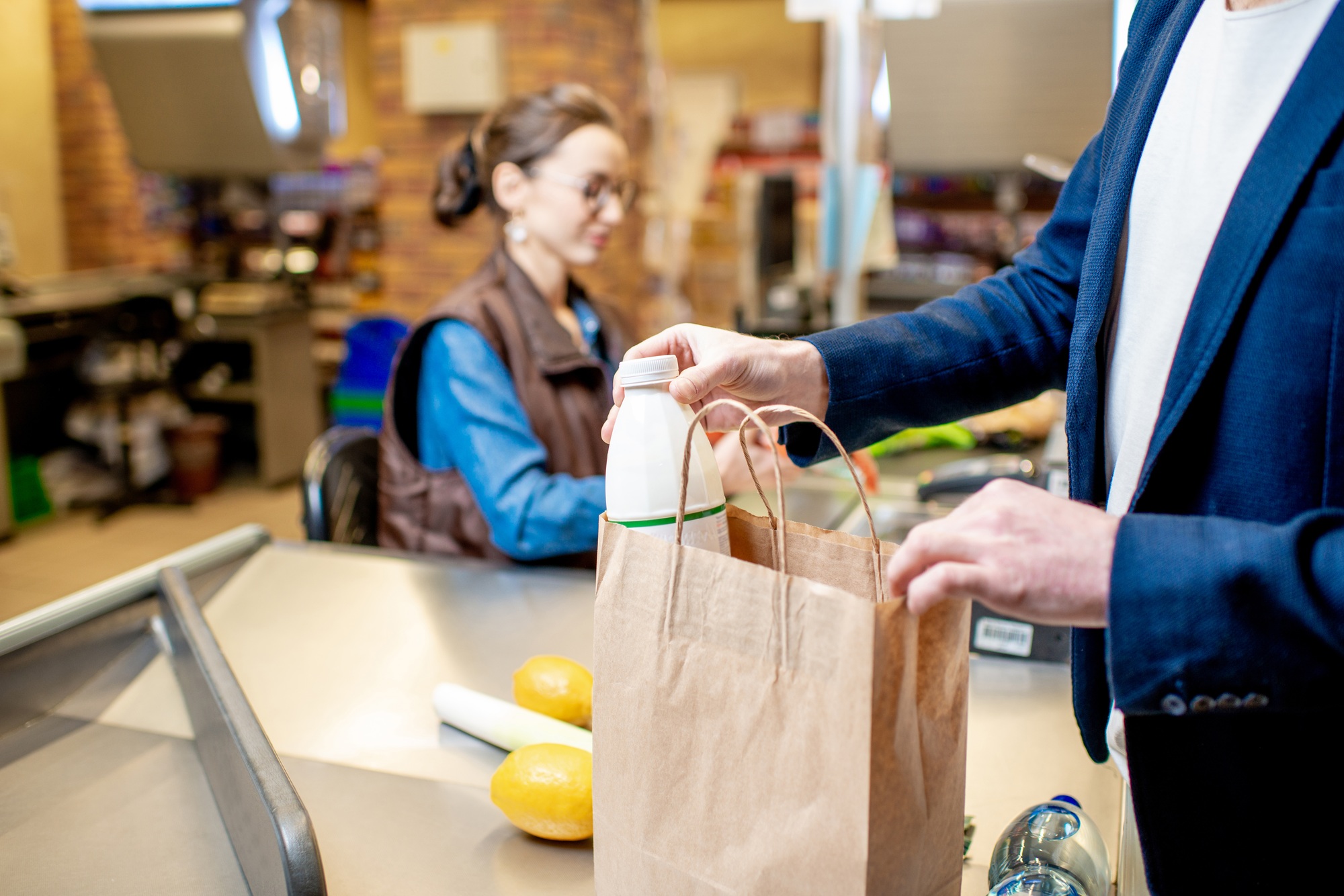 Man packing food at the cash register