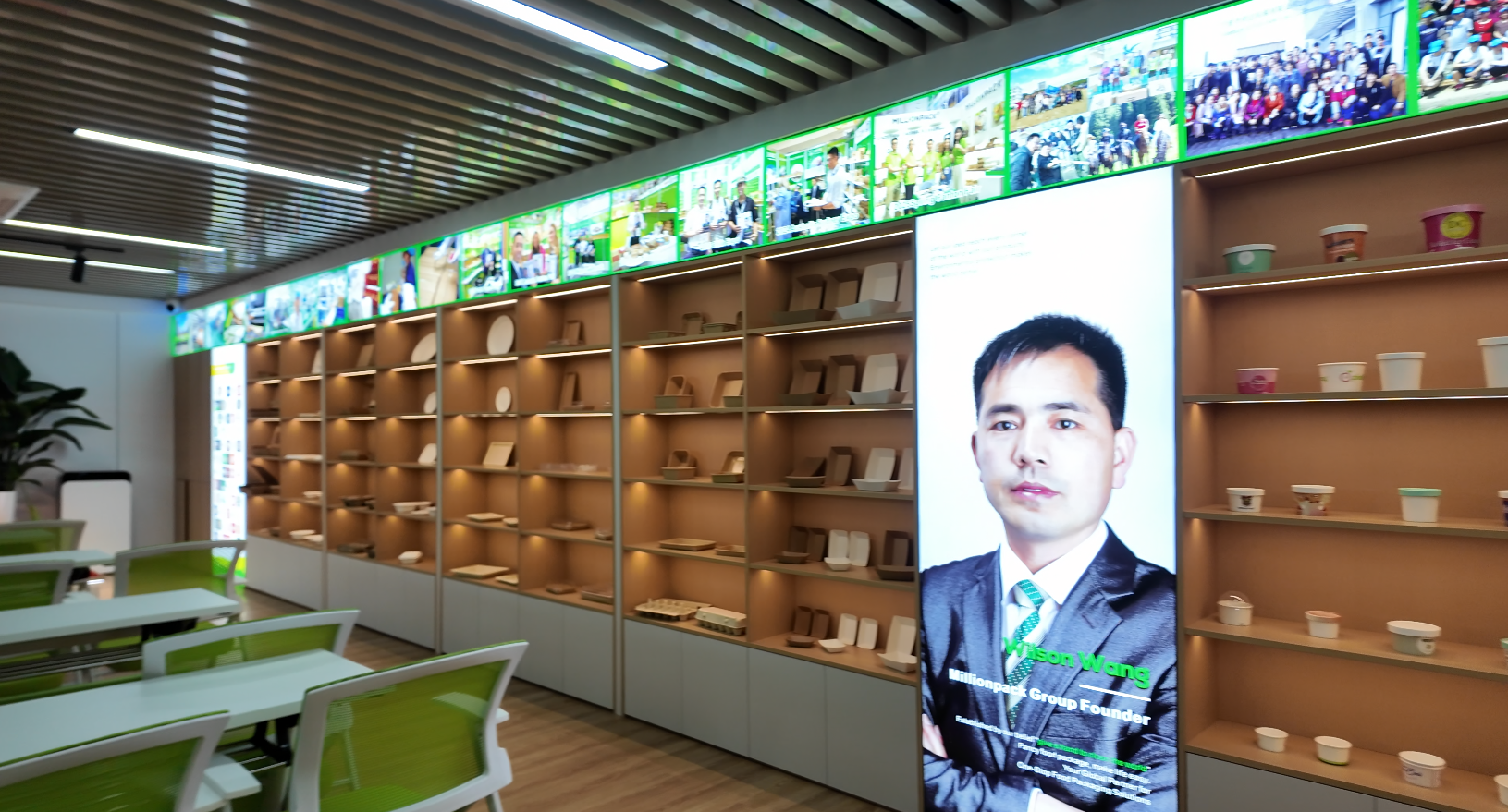 Paper food packaging samples displayed on illuminated shelves in the new office showroom