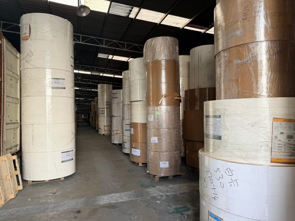 Wilson Wang Profile 11 Wrapped rolls of paper stored inside the material warehouse